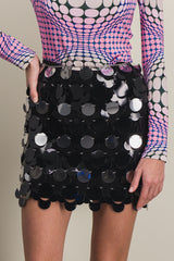 Sparkle mini skirt with circular mirror-effect discs